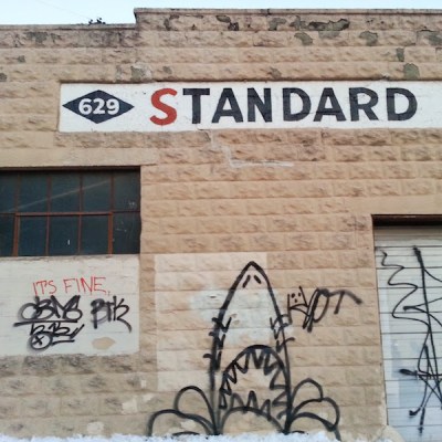 Graffiti on garage wall similar to the "Jaws" movie poster