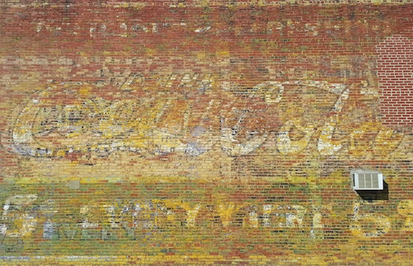 Painted wall advertisement for Coca-Cola