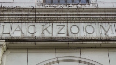 Terra cotta tile reading "Lackzoom"