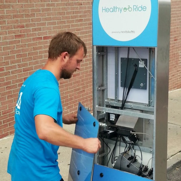 NextBike employee restarting a Healthy Ride station, Pittsburgh, Pa.