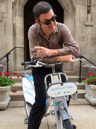 rider posed on a Healthy Ride rental bicycle, Pittsburgh, Pa.