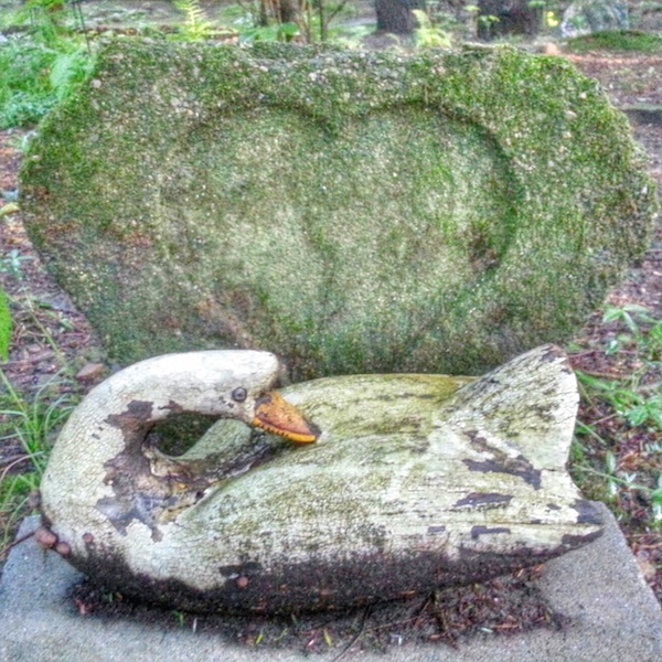 grave marker with a wooden duck and stone heart, Lily Dale, NY