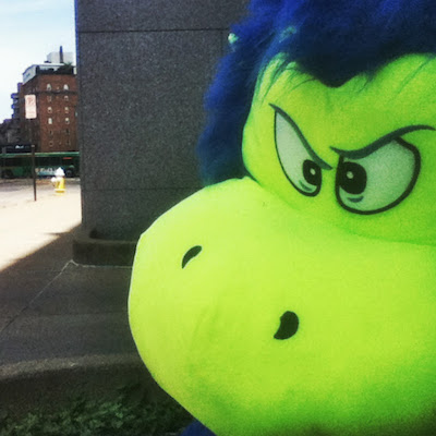 stuffed monster toy on street