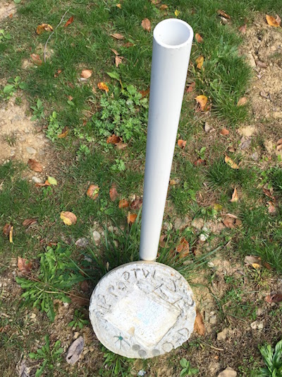Homemade grave with PVC pipe and cast concrete medallion, Highwood Cemetery, Pittsburgh, PA