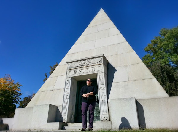 Jennie Benford, Homewood Cemetery archivist, in front of Brown mausoleum