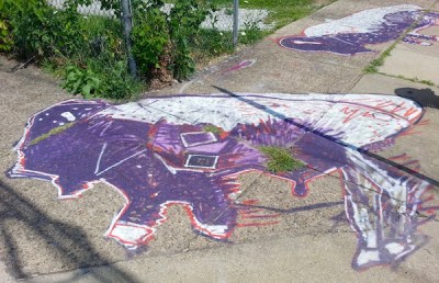 sidewalk painting of purple and white buffalos