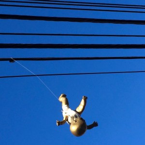 Golden baby hanging from power lines, Pittsburgh, PA