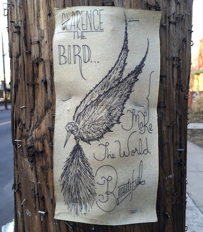 ink on cardboard street art of a bird with the text "Clarence the Bird...Make the world beautiful", Pittsbugh, PA