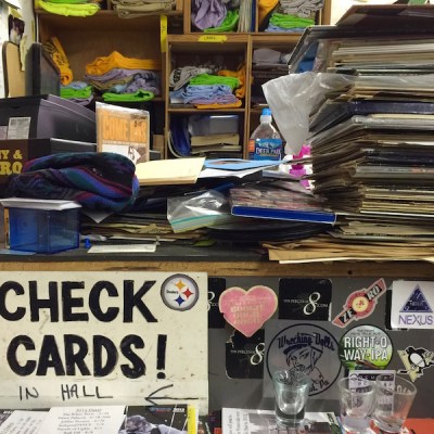 checkout counter loaded with records, shot glasses, and junk, Jerry's Records, Pittsburgh, PA