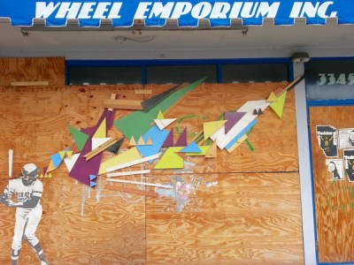 wheat paste and colored wood block street art of Roberto Clemente, Pittsburgh, PA