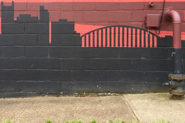 Pittsburgh skyline mural painted on cinderblock building
