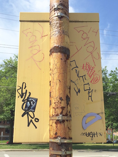 purple protractor glued to power box on light pole, Pittsburgh, PA