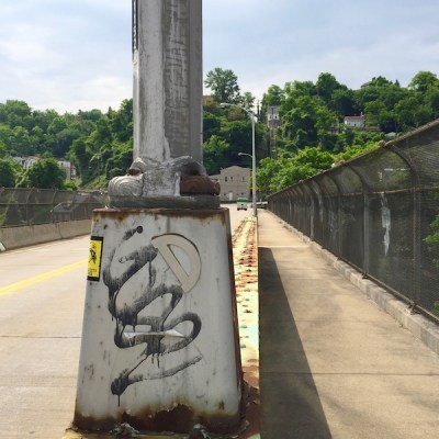 protractor glued to lamp post base, Swinburne Bridge, Pittsburgh, PA