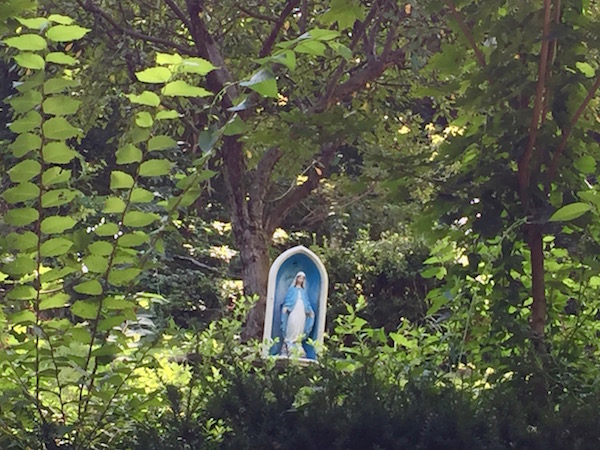 Mary statuette in wooded yard, Pittsburgh, PA