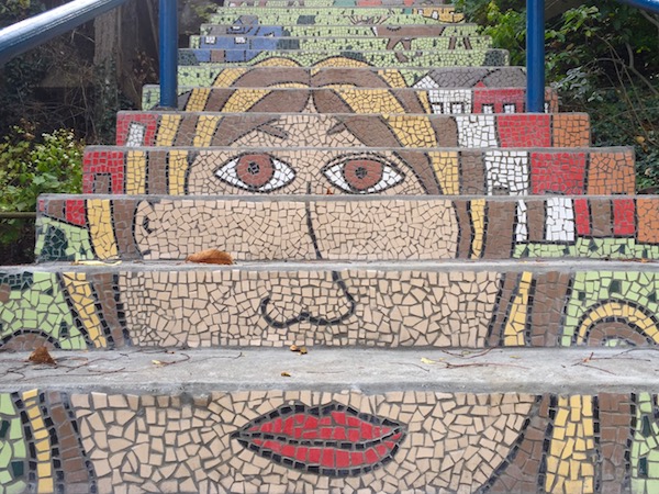 Detail of public steps with mosaic decoration of a woman's head, Pittsburgh, PA