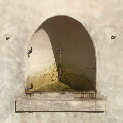 masonry enclosure around pipe dribbling natural spring water, Pittsburgh, PA
