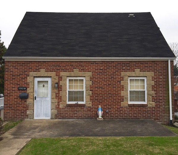 Mary statuette in front of brick house, Pittsburgh, PA