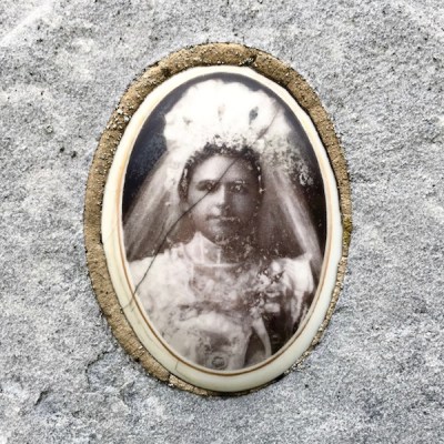 detail from marble headstone with embedded ceramic photograph of a woman in bridal gown, Loretto Cemetery, Pittsburgh, PA
