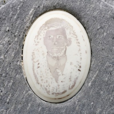 ceramic photograph with image almost completely disappeared on headstone of grave, Loretto Cemetery, Pittsburgh, PA