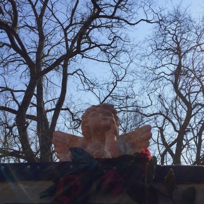 ceramic cherub figurine on garage roof, Pittsburgh, PA