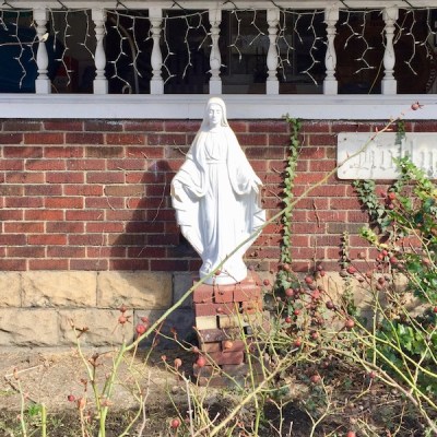 statuette of Mary on pedestal of bricks, Pittsburgh, PA