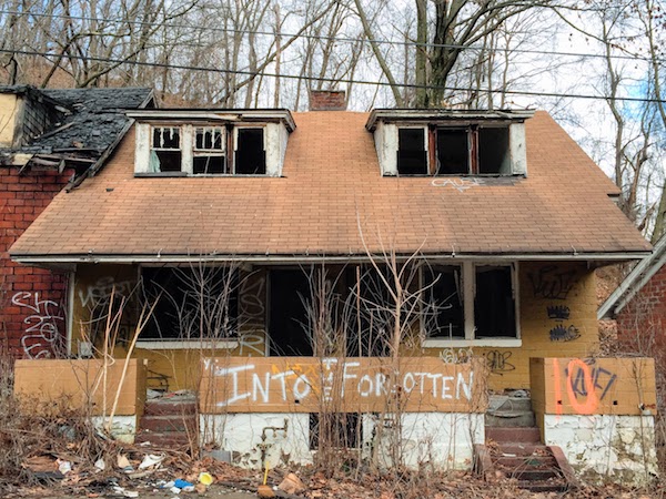 abandoned house with spray-painted graffiti "Into the forgotten", Clairton, PA