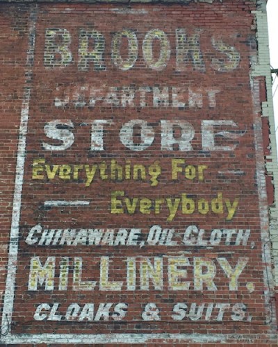 ghost sign for Brooks Department Store, with text "Everything for Everybody, chinaware, oil cloth, millinery, cloaks & suits", Monessen, PA