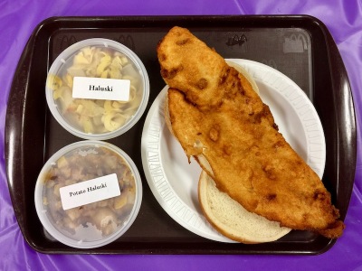 fish sandwich with sides of haluski and potato haluski from church fish fry