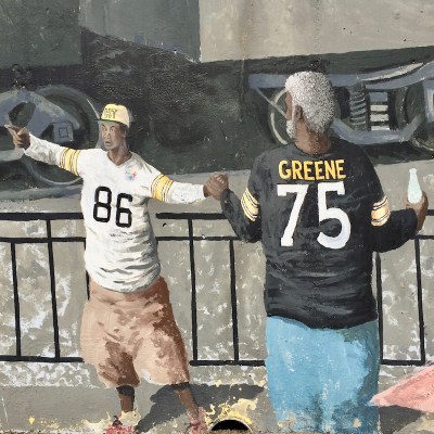 mural detail of two men in Pittsburgh Steelers team jerseys, Tarentum, PA