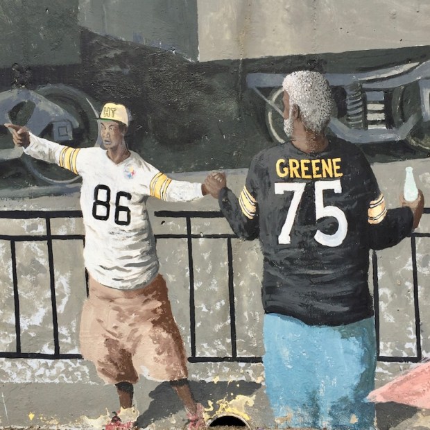 mural detail of two men in Pittsburgh Steelers team jerseys, Tarentum, PA