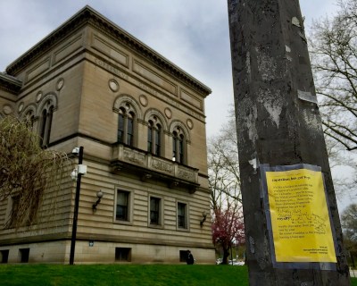 poems of The Dirty Poet taped to a lamp post, Pittsburgh, PA