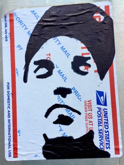 US postal service priority mail sticker with black ink portrait of man with baseball cap, Pittsburgh, PA