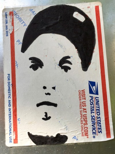 US postal service priority mail sticker with black ink portrait of man with baseball cap, Pittsburgh, PA