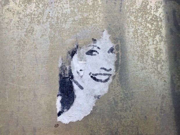 US postal service priority mail sticker with black ink portrait of smiling woman, Pittsburgh, PA