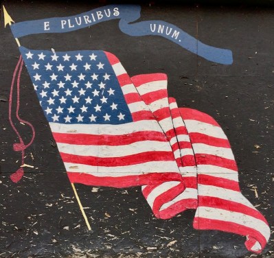 plywood storefront painted like 48-star American flag, West Newton, PA