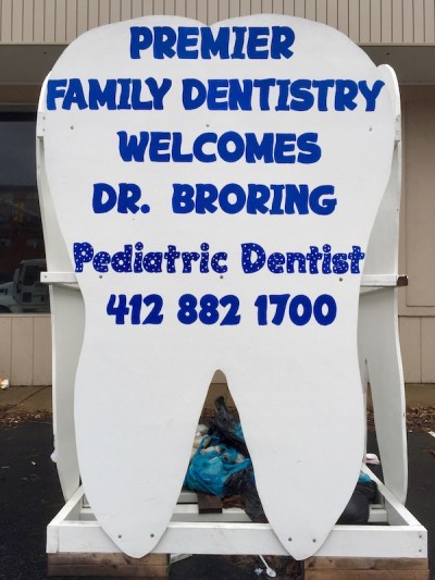 large tooth-shaped sign reading "Premier Family Dentistry welcomes Dr. Broring", Baldwin Borough, PA