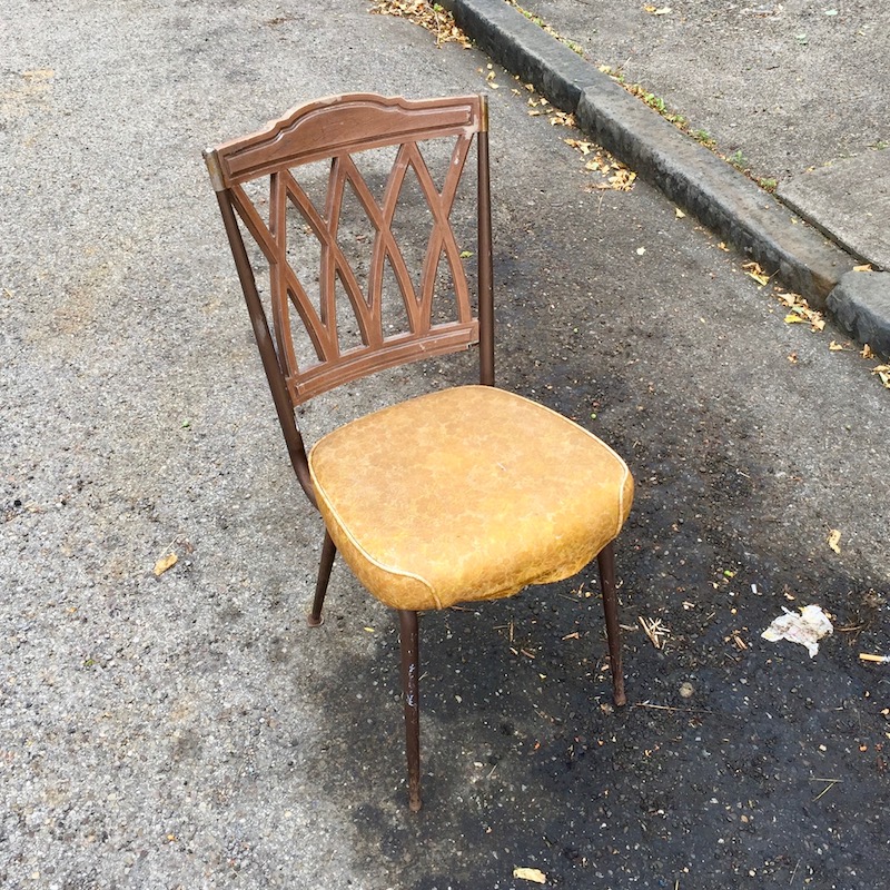 single chair from dinette set on street, acting as a "parking chair", Pittsburgh, PA