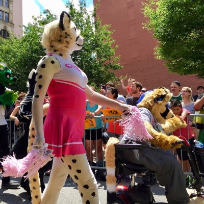 fursuit costome of leopard wearing cheerleader outfit, Anthrocon 2017 Fursuit Parade, Pittsburgh, PA