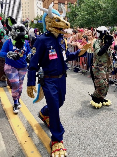fursuit costume of dragon in police uniform, Anthrocon 2017 Fursuit Parade, Pittsburgh, PA
