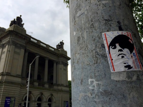 postal slap on light pole with portrait of young man in baseball cap, Pittsburgh, PA