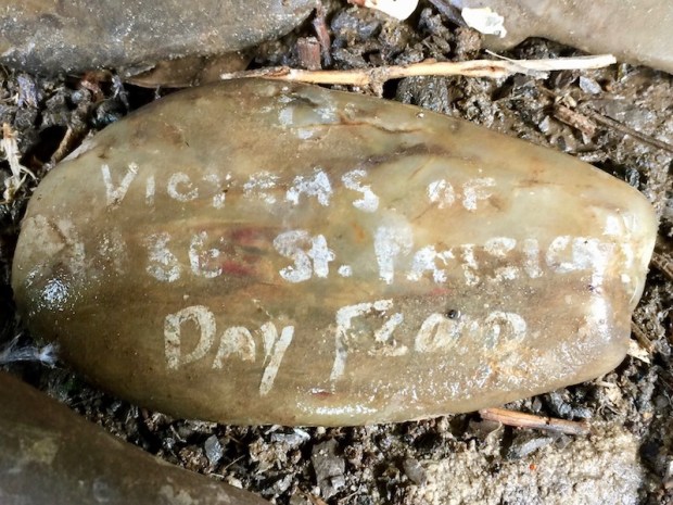 river stone painted with white text reading "Victims of 1936 St. Patrick's Day Flood", Pittsburgh, PA