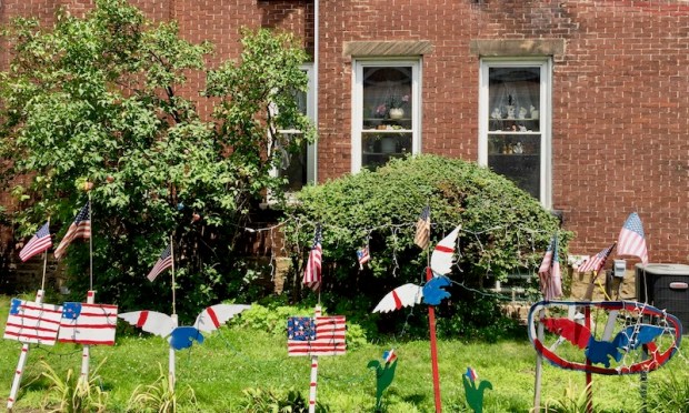 handmade wood cut Independence Day lawn decorations including flags, eagles, and star flowers, Beaver, PA