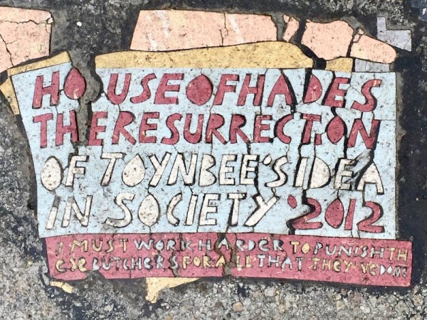 House of Hades "Toynbee Tile" imprinted on city street, Pittsburgh, PA