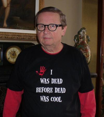 John Kirch wearing a t-shirt with the message "I was dead before dead was cool"