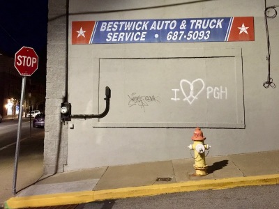 exterior of Bestwick Auto & Truck Service company with graffiti "I [heart] Pittsburgh"