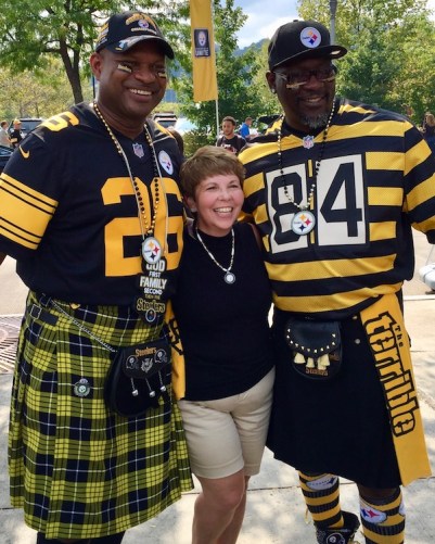 two men wearing black-and-gold kilts and Steelers jerseys at Heinz Field, Pittsburgh