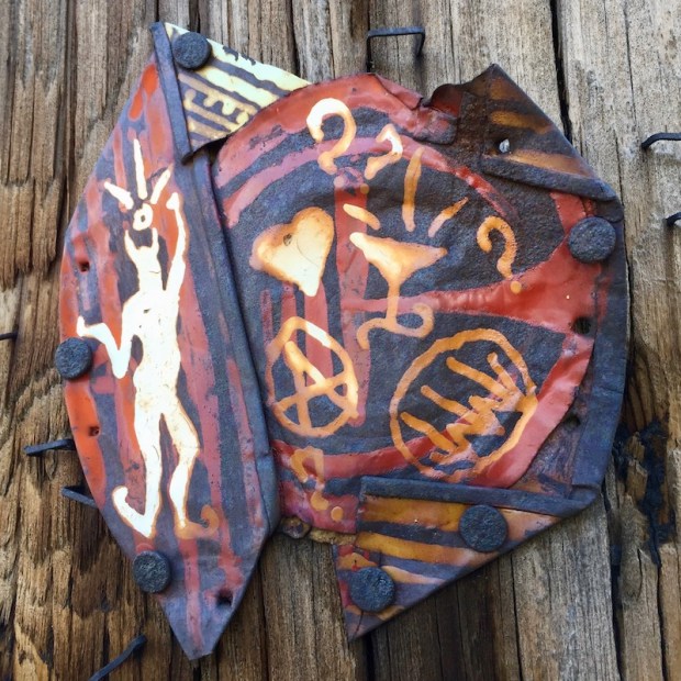 tin can flattened and painted, nailed to telephone pole, Pittsburgh, PA