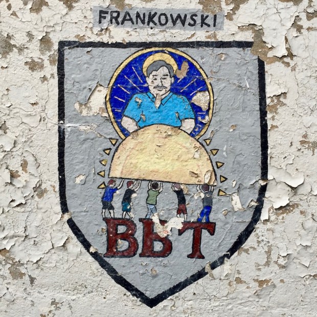 mural for Frankowski family with people holding giant pierogie, Bloomfield Bridge Tavern, Pittsburgh, PA