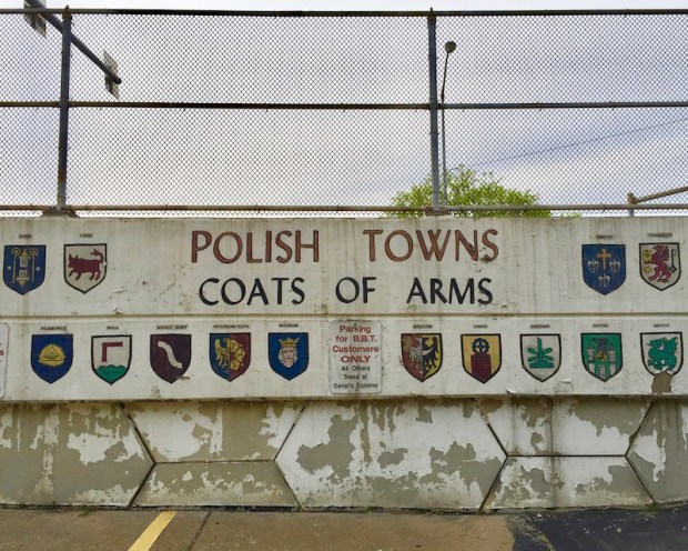 mural of Polish towns coats of arms painted on parking lot wall, Bloomfield Bridge Tavern, Pittsburgh, PA
