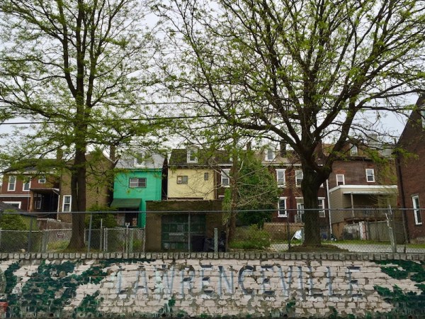 Lawrenceville neighborhood welcome sign painted as a mural on a retaining wall, Pittsburgh, PA